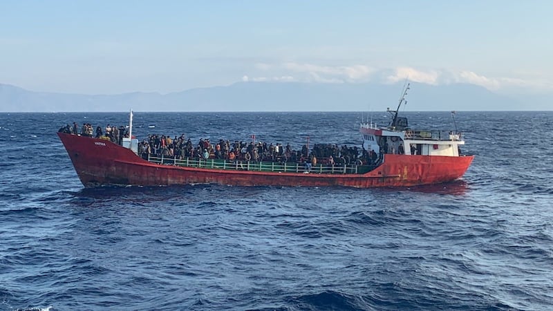 A cargo ship carries migrants during a rescue operation off the island of Crete in October.  Reuters