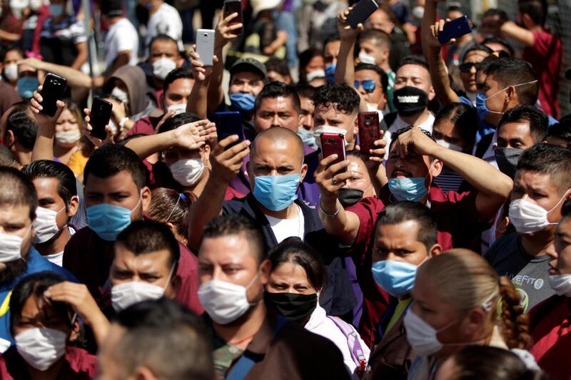 Employees of Electrocomponentes de Mexico are seen during a protest to halt work amid the spread of coronavirus, in Ciudad Juarez, Mexico. Reuters
