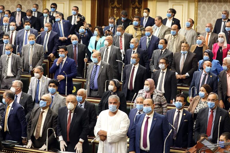 Egyptian parliament members attend a general session in the capital Cairo on July 20, 2020.      Egypt's parliament greenlighted today the possible deployment of troops in Libya to support Cairo's ally Khalifa Haftar, if rival Turkish-backed forces recapture the city of Sirte, the house said. / AFP / -
