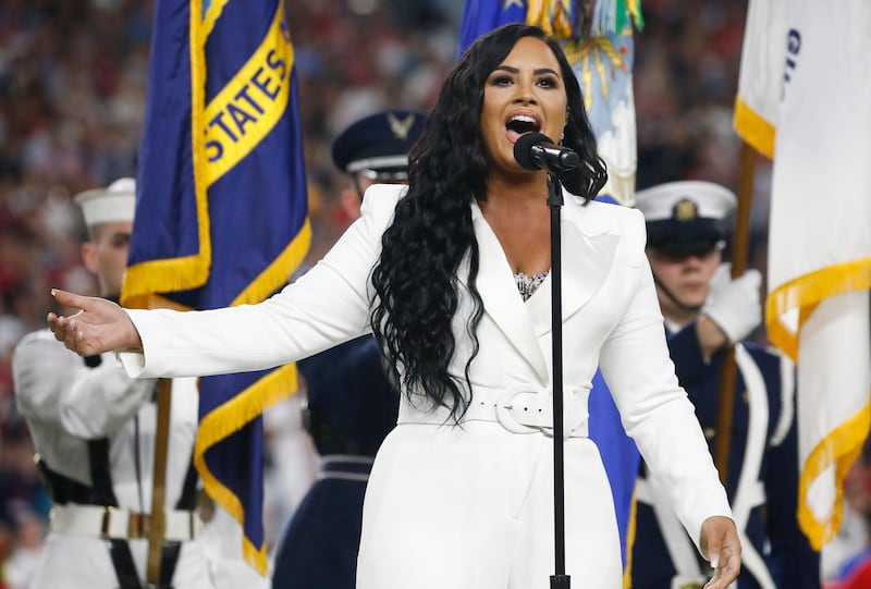 epa08189243 US singer Demi Lovato performs the National Anthem before the AFC Champion Kansas City Chiefs play the NFC Champion San Francisco 49ers in the National Football League's Super Bowl LIV at Hard Rock Stadium in Miami Gardens, Florida, USA, 02 February 2020.  EPA-EFE/LARRY W. SMITH