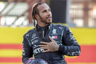 Mercedes driver Lewis Hamilton of Britain celebrates after winning the Formula One Grand Prix of Tuscany, at the Mugello circuit in Scarperia, Italy, Sunday, Sept. 13, 2020. (AP Photo/Luca Bruno, Pool)