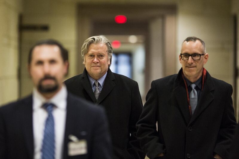 Steve Bannon, former chairman of Breitbart News Network LLC, center, leaves after testifying before the House Intelligence Committee on Capitol Hill in Washington, D.C., U.S., on Tuesday, Jan. 16, 2018. The House Intelligence Committee issued a subpoena Tuesday for testimony by Bannon after his closed-door interview with the panel's Russia probe became entangled in legal disputes over whether the former chief strategist to President Donald Trump could invoke executive privilege. Photographer: Zach Gibson/Bloomberg