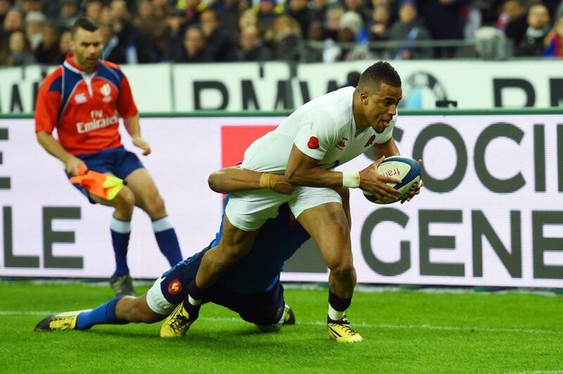 Anthony Watson of England scores his team’s third try despite the tackled from Wesley Fofana of France during the RBS Six Nations match between France and England at the Stade de France on March 19, 2016 in Paris, France. (Photo by Shaun Botterill/Getty Images)