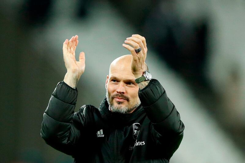 Arsenal's Swedish Interim head coach Freddie Ljungberg applauds the fans at The London Stadium following his side's 3-1 Premier League win. AFP