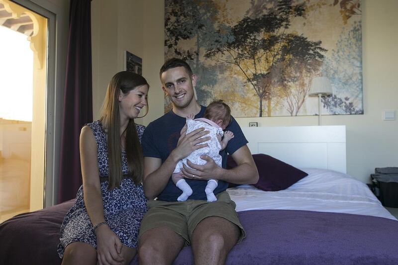 Readers say that Jo and Nathan Sadler have done the right thing by moving from a villa into a small apartment so they can save money to buy their own house. Mona Al Marzooqi / The National 

