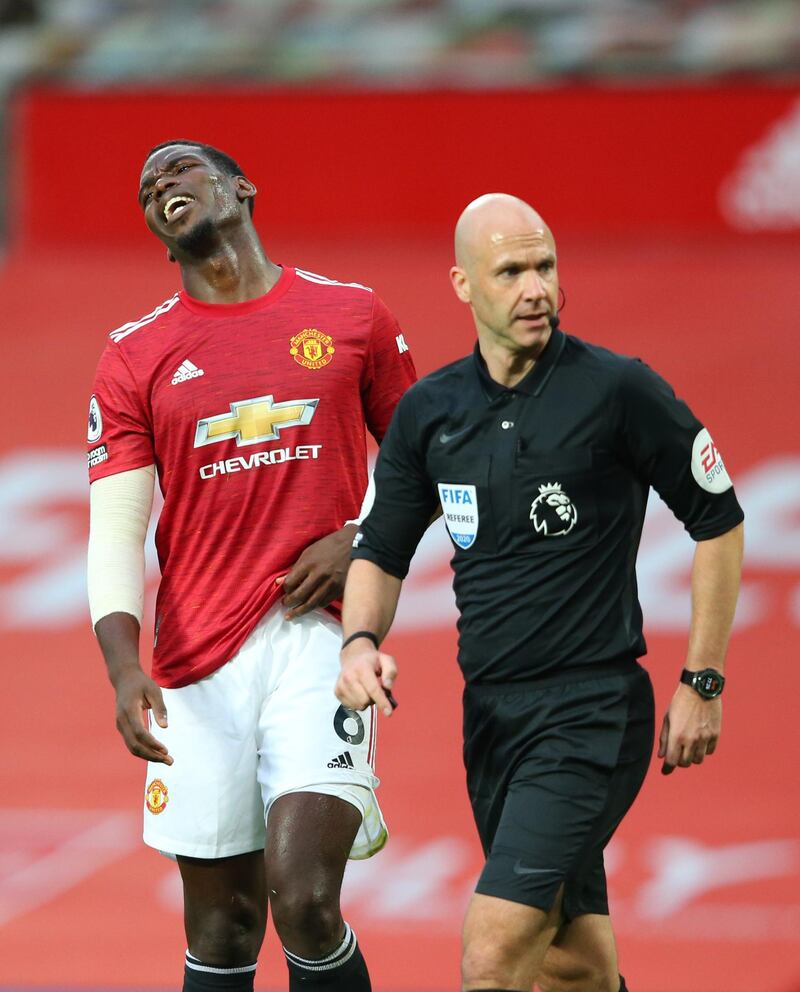 MANCHESTER, ENGLAND - OCTOBER 04: Paul Pogba of Manchester United reacts after Referee Anthony Taylor awards a penalty during the Premier League match between Manchester United and Tottenham Hotspur at Old Trafford on October 04, 2020 in Manchester, England. Sporting stadiums around the UK remain under strict restrictions due to the Coronavirus Pandemic as Government social distancing laws prohibit fans inside venues resulting in games being played behind closed doors. (Photo by Alex Livesey/Getty Images)