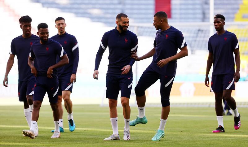 Soccer Football - Euro 2020 - France Training - Allianz Arena, Munich, Germany - June 14, 2021  France's Kylian Mbappe, and Karim Benzema with teammates during training REUTERS/Kai Pfaffenbach