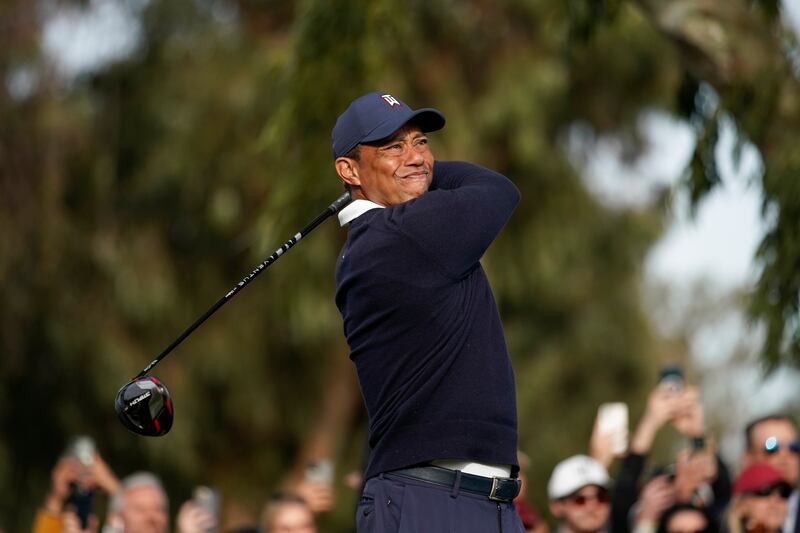 Tiger Woods hits his tee shot on the 15th hole. EPA