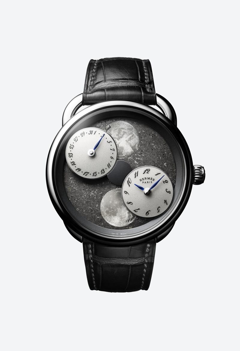 Arceau L’heure de la Lune: Limited to just 30 pieces, this new Arceau L’heure de la Lune watch by Hermes is brimming with celestial beauty. It features the simultaneous display of moon phases in both the northern and southern hemispheres, represented by two mother-of-pearl moons that emerge from behind two mobile counters that gravitate on a “Black Sahara” meteorite dial. With a total thickness of just 4.2 millimeters, the watch's 117 polished and bead-blasted components are incorporated within a Manufacture Hermès H1837 movement.