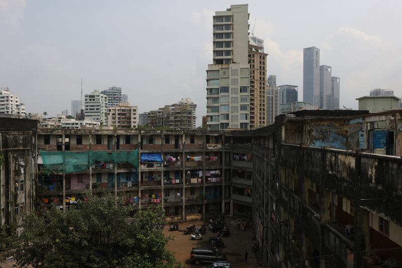 This building complex, set among the  luxury towers and villas of Mumbai's most exclusive postcode, is an example of the risks some middle-class employees are willing to take for a home in one of the world's most expensive property markets