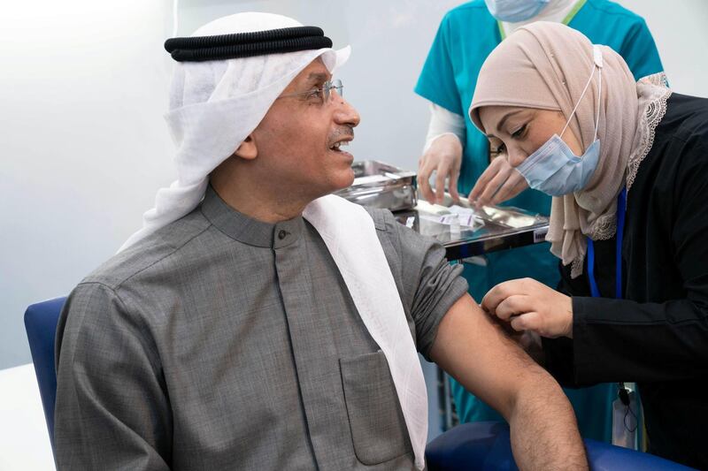 Tareq Eid Al-Mezrem, Head of Government Center Council of Ministers General Secretary, gets a dose of Covid-19 vaccine in Kuwait City. Reuters