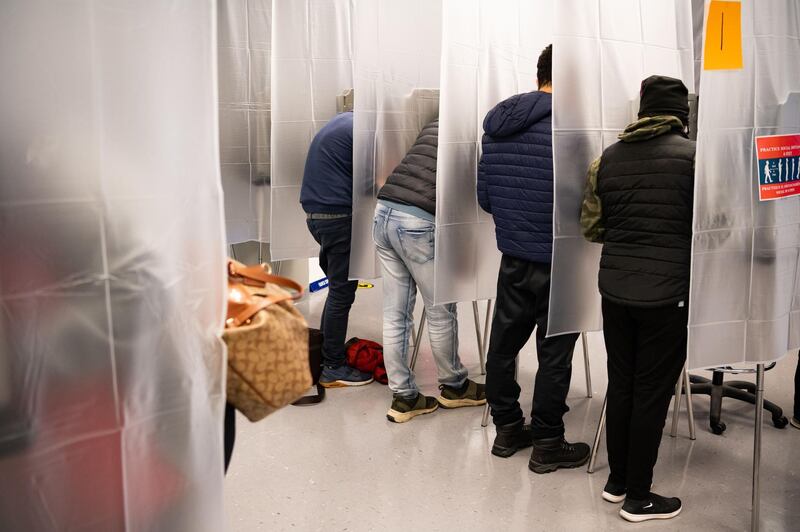 Residents of Cuyahoga county fill out paper ballots for early, in person voting at the board of elections office in downtown Cleveland, Ohio. AFP