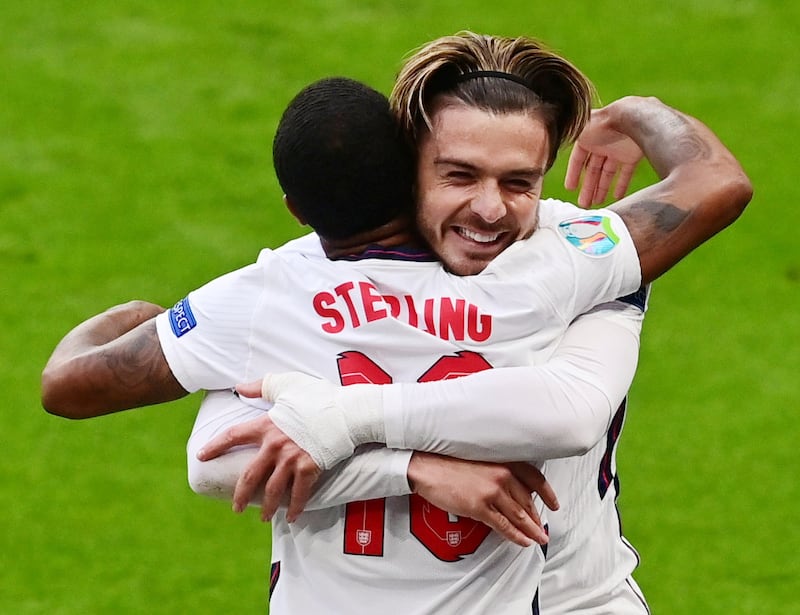 Jack Grealish congratulates England's Raheem Sterling after scoring against the Czech Republic. Reuters