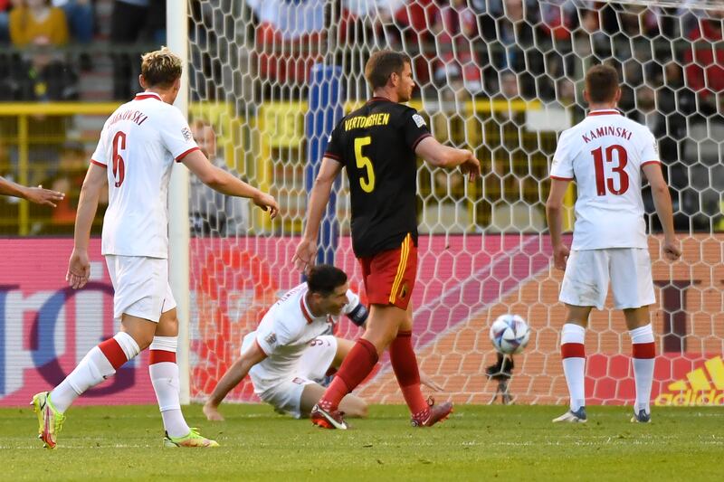 Poland's Robert Lewandowski scores against Belgium. AP