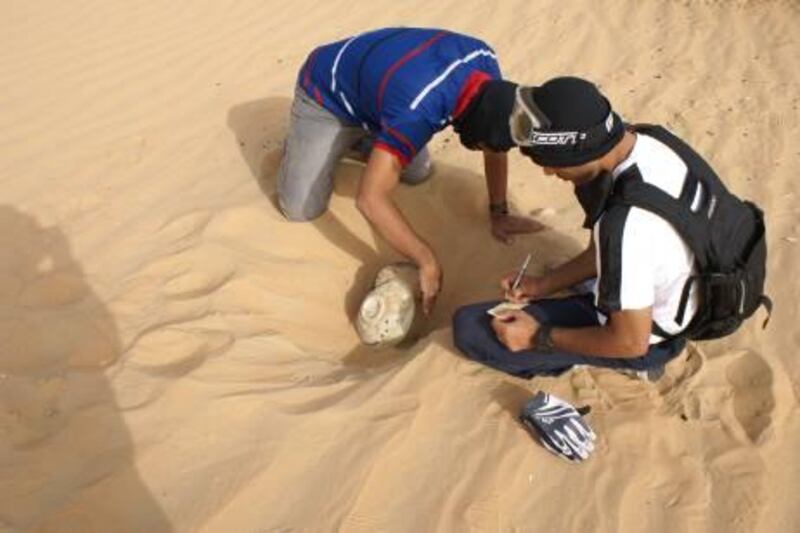 Provided photo of  Ali Rahman al Meqbali And Hamdan Rashed al Rashedi  on an archaeological dig
Courtesy ADACH for story by Rym  ** (note I tried to get confirmation on names but no response from ADACh-guessed from cross referencing captions of the live shoot to file names of these-julie)