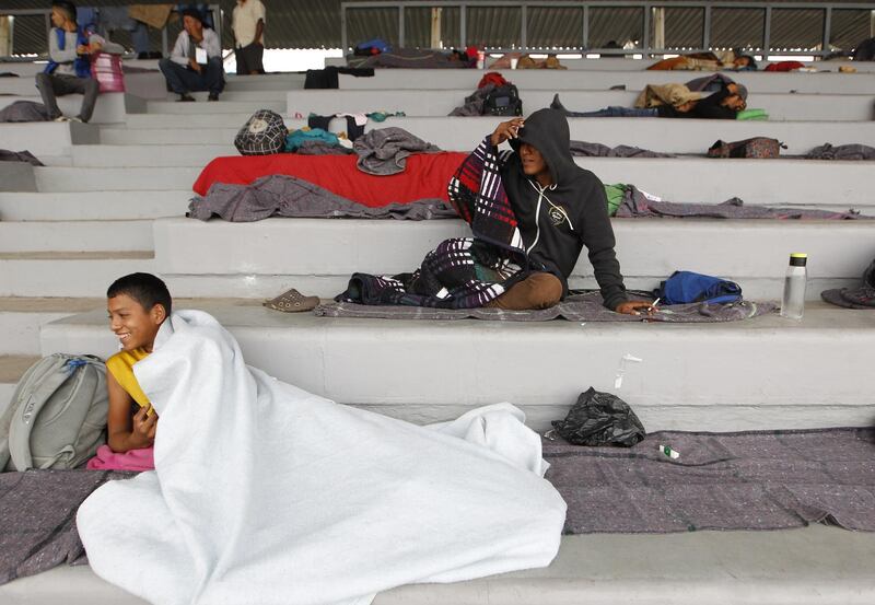 Members of the caravan rest at the shelter provided in the Jesus 'Palillo' Martinez stadium, which is located within the complex of the Sport City of Magdalena Mixhiuca, in Mexico City. EPA