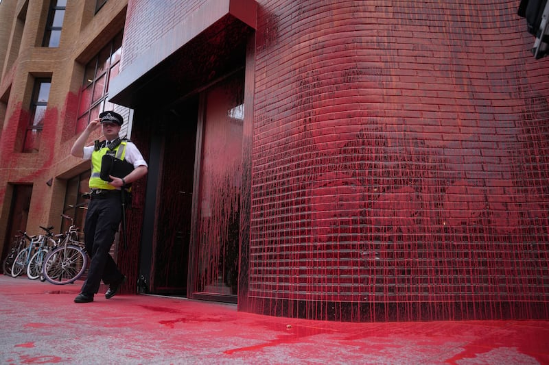 Police outside Labour Party headquarters in London after red paint was thrown over the outside of the building. PA