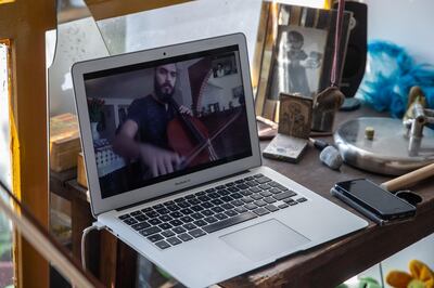 MEXICO CITY, MEXICO - MAY 05: A computer with a student is seen during the Musician Natalia Perez Turner cello online class on May 05, 2020 in Mexico City, Mexico. Due to coronavirus movement restrictions, music teachers  are now giving online lessons. (Photo by Hector Vivas/Getty Images)