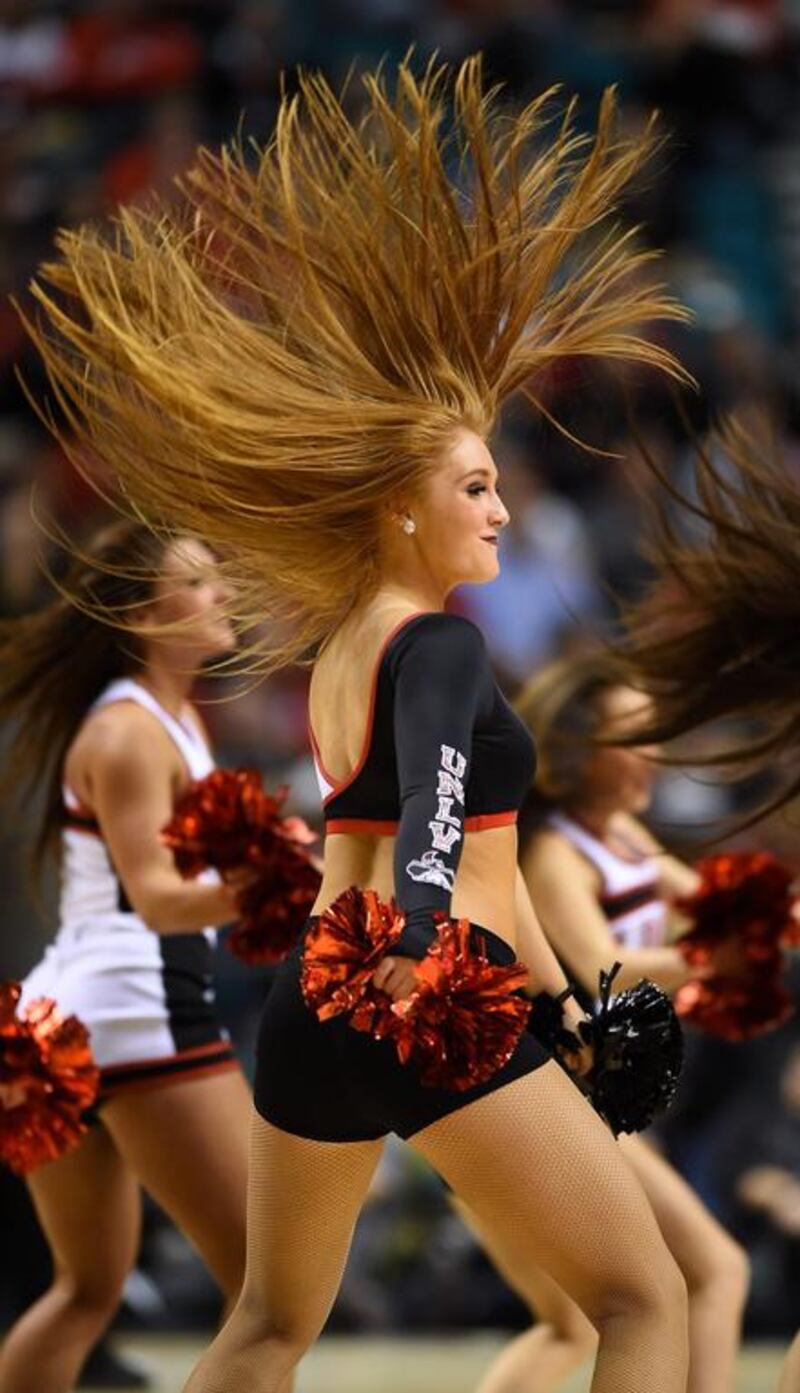 A UNLV cheerleader performs during the team’s game against the Utah Utes in the 2014 MGM Grand Showcase basketball event at the MGM Grand Garden Arena in Las Vegas, Nevada. Ethan Miller / Getty