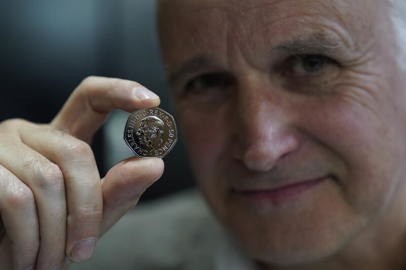 Martin Jennings with one of the first coins produced.
