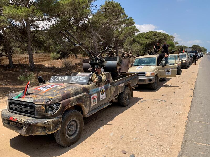 Troops loyal to Libya's internationally recognized government are seen in military vehicles as they prepare before heading to Sirte, in Tripoli, Libya, Libya July 6, 2020. REUTERS/Ayman Sahely