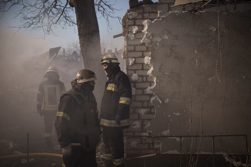 Firefighters work to extinguish a fire at a house destroyed in a Russian attack in Kharkiv, Ukraine. AP