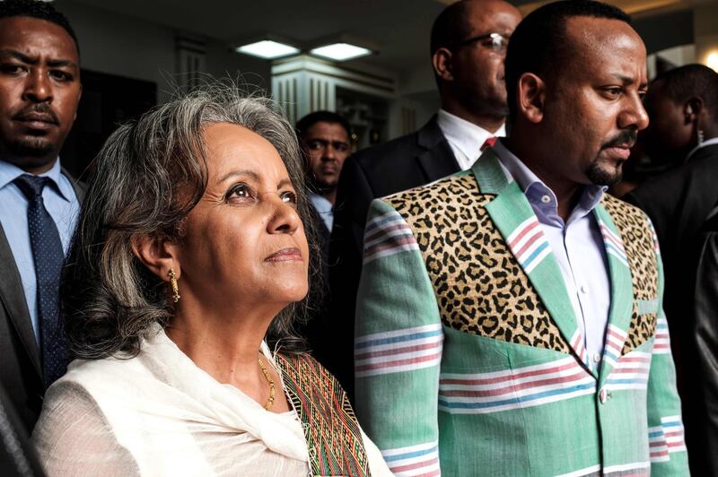 TOPSHOT - Sahle-Work Zewde (L) walks with Prime Minister Abiy Ahmed (R) after being elected as Ethiopia's first female President at the Parliament in Addis Ababa on October 25, 2018.  / AFP / EDUARDO SOTERAS
