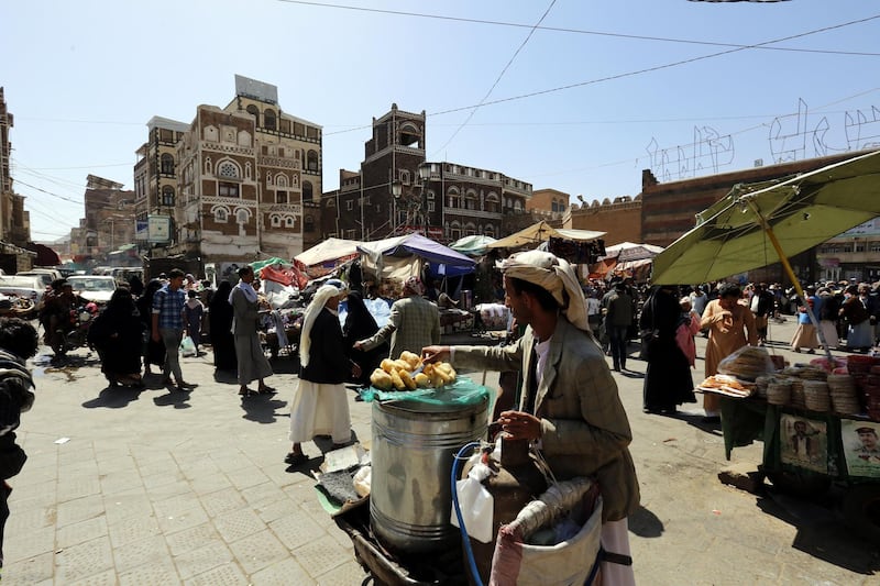 Yemenis walk through a market ahead of Ramadan in Sana'a, Yemen.  EPA