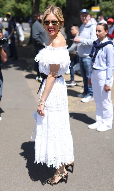 Actress Sienna Miller wears Ralph Lauren to arrive at Wimbledon on day seven of the Wimbledon Championships on July 3, 2022. PA Wire