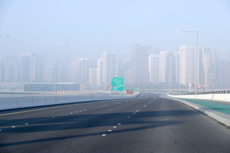 Speed limits were reduced on several motorways in the UAE capital on Thursday as a result of the fog. Khushnum Bhandari / The National