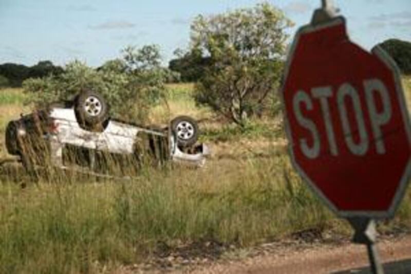 The wrecked vehicle lays alongside the  road near Harare Saturday, March 7, 2009, after being involved in an accident  Friday in which Zimbabwean prime minister Morgan Tsvangirai was injured and his wife Susan was killed. (AP Photo)     *** Local Caption ***  JOH107_ZIMBABWE_TSVANGIRAI.jpg