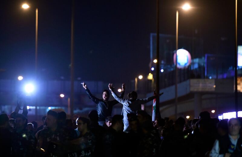 Protesters shout slogans as they block the highway leading to the Presidential palace during a protest to demand the formation of a new government in Baabda, east Beirut.  EPA