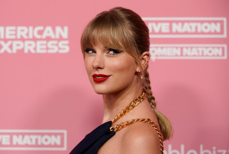 FILE PHOTO: Singer Taylor Swift arrives on the red carpet for the "Billboard Women in Music" event in Los Angeles, California, U.S., December 12, 2019.  REUTERS/Mike Blake/File Photo