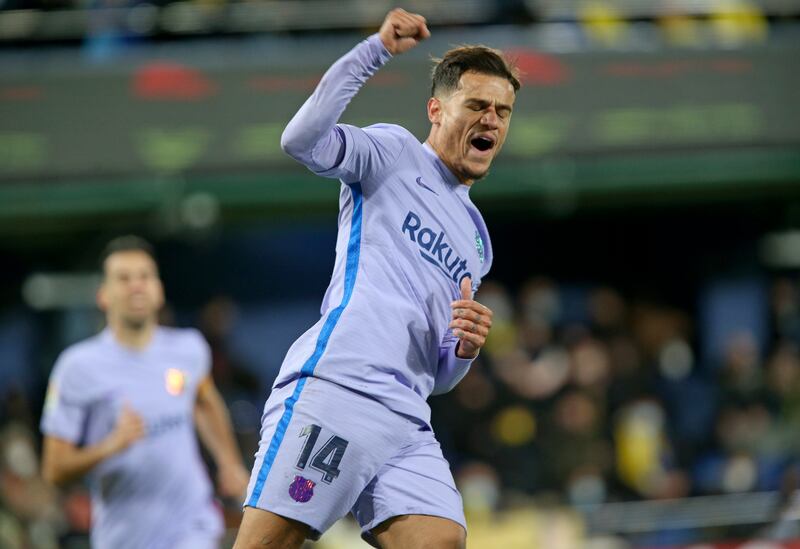 Barcelona's Philippe Coutinho celebrates after scoring his side's third goal during the La Liga soccer match between Villarreal and Barcelona in Villarreal, Spain, Saturday, Nov.  27, 2021.  (AP Photo / Alberto Saiz)