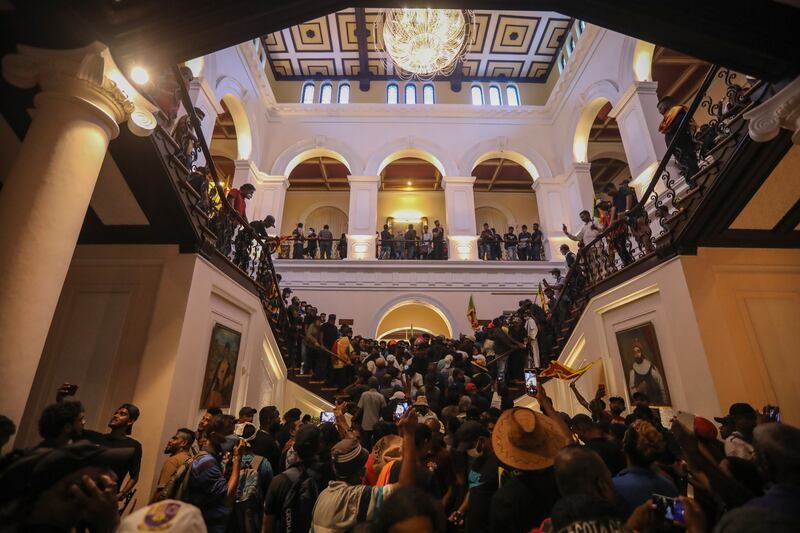 Protesters crowd inside the president's official residence. EPA