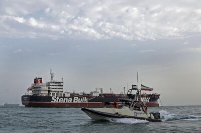 TOPSHOT - A picture taken on July 21, 2019, shows Iranian Revolutionary Guards patrolling around the British-flagged tanker Stena Impero as it's anchored off the Iranian port city of Bandar Abbas.
 Iran warned Sunday that the fate of a UK-flagged tanker it seized in the Gulf depends on an investigation, as Britain said it was considering options in response to the standoff. Authorities impounded the Stena Impero with 23 crew members aboard off the port of Bandar Abbas after the Islamic Revolutionary Guard Corps seized it Friday in the highly sensitive Strait of Hormuz. / AFP / MIZAN NEWS AGENCY / Hasan Shirvani
