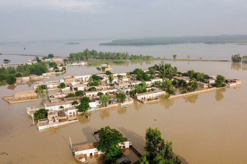 Partially submerged houses in Charsadda district. AFP