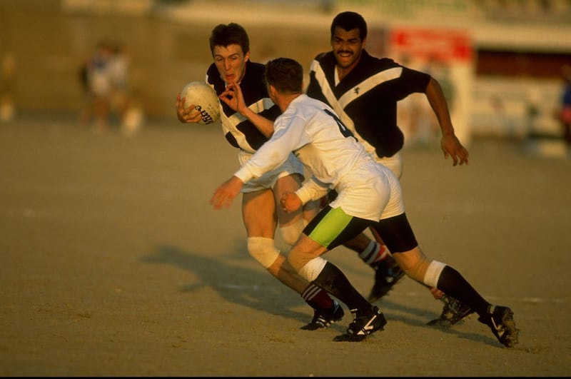 1990:  Michael Dodds (left) of Saltires is charged down during the Dubai Sevens match against Hong Kong in Dubai, United Arab Emirates. \ Mandatory Credit: Russell  Cheyne/Allsport