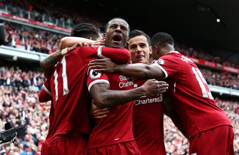 Liverpool's Georginio Wijnaldum celebrates scoring his side's first goal with teammates. Jan Kruger / Getty Images