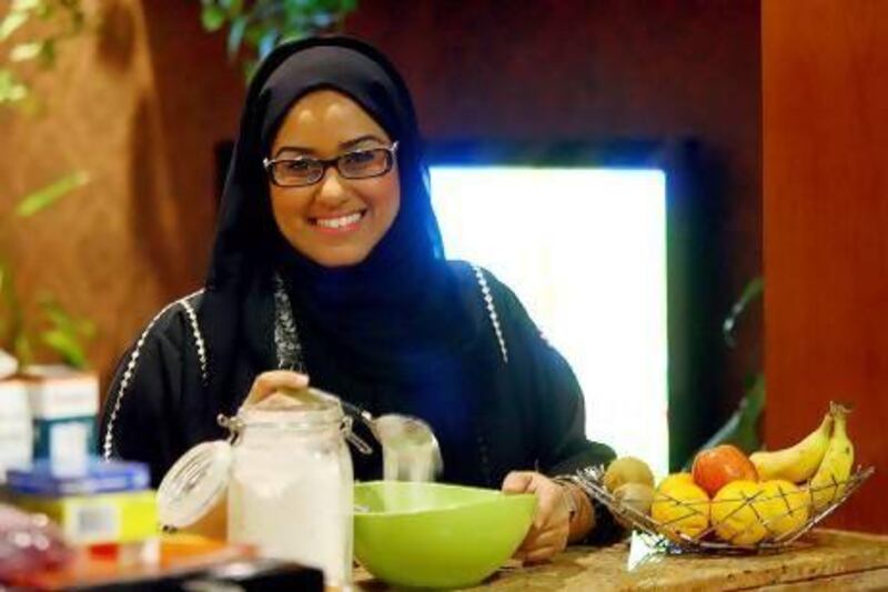 Fatma Salim, a Dubai government employee from Yemen, preparing traditional sweets for Eid. Satish Kumar / The National