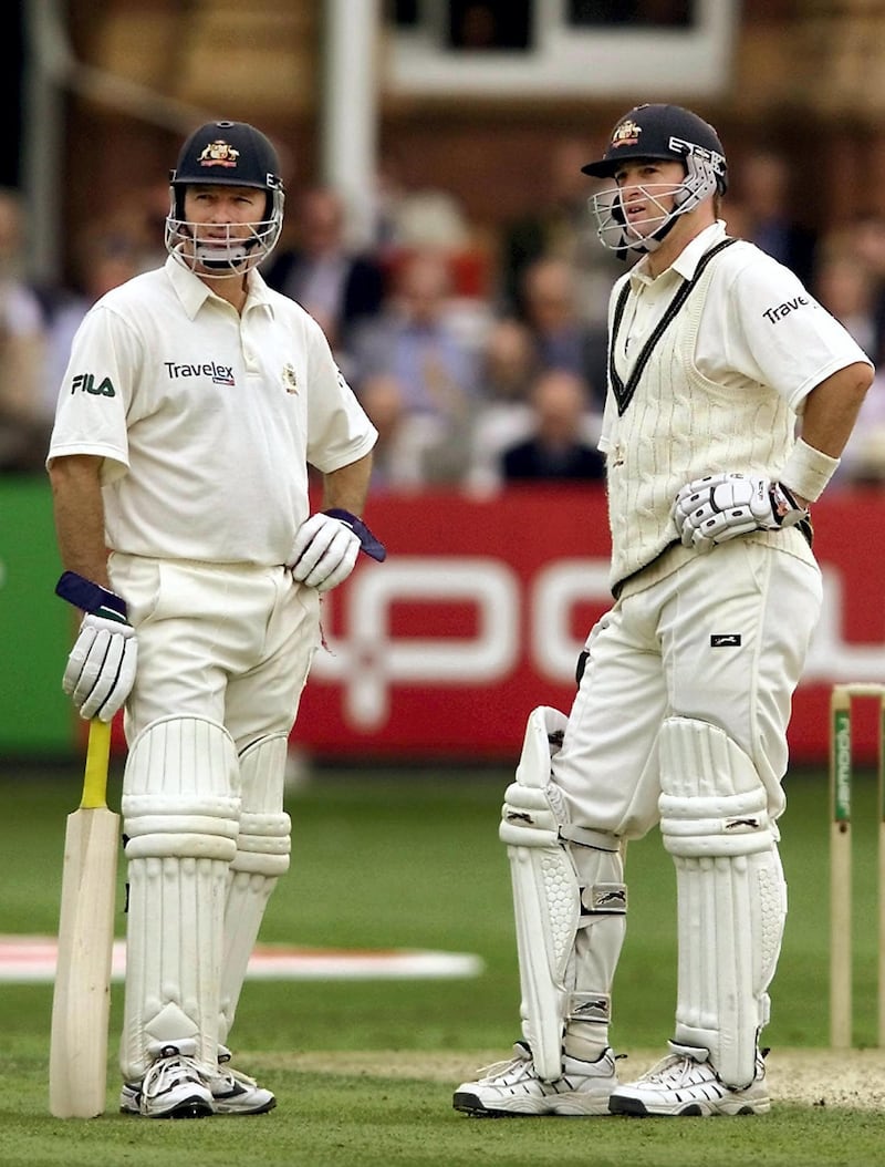 Australian batsmen Steve Waugh (L) and brother Mark Waugh (R) look at a replay screen on the 2nd day of the 2nd Test Match being played at Lords in London 20 July 2001. England scored 187 in their first innings and in reply Australia is 255-5.   AFP PHOTO/WILLIAM WEST (Photo by WILLIAM WEST / AFP)