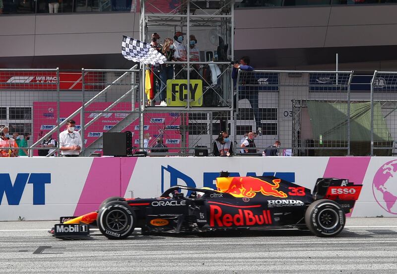 Red Bull's Max Verstappen crosses the line to win the race.