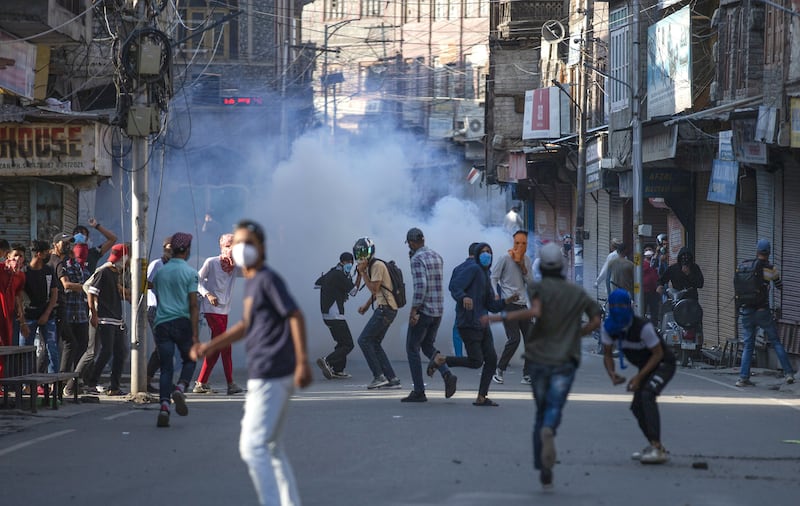 Protesters clash with Indian police during a protest against the sentencing of Kashmiri separatist leader Yasin Malik, in Srinagar, the summer capital of Indian Kashmir. EPA