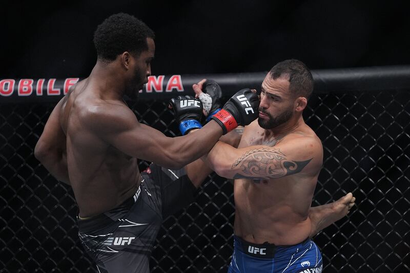 Geoff Neal lands a kick against Santiago Ponzinbbio. Reuters