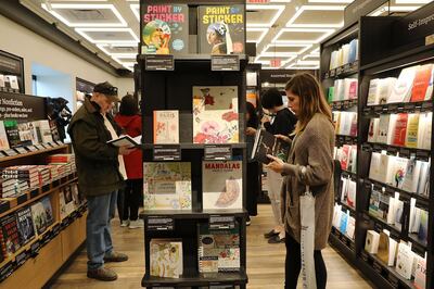 NEW YORK, NY - MAY 25:  People shop in the newly opened Amazon Books on May 25, 2017 in New York City. Amazon.com Inc.'s first New York City bookstore occupies 4,000 square feet in The Shops at Columbus Circle in Manhattan and stocks upwards of 3,000 books. Amazon Books, like the Amazon Go store, does not accept cash and instead lets Prime members use the Amazon app on their smartphone to pay for purchases. Non-members can use a credit or debit card.  (Photo by Spencer Platt/Getty Images)