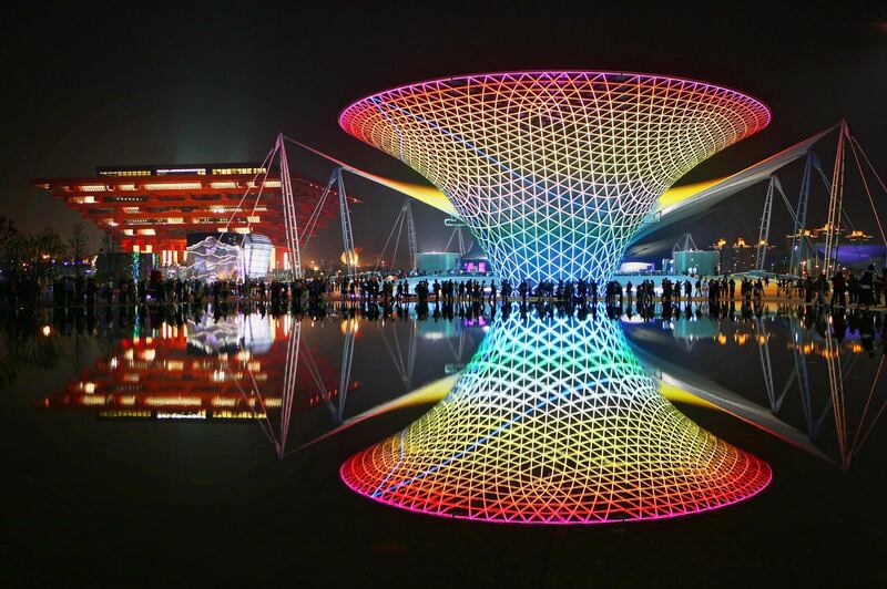 SHANGHAI, CHINA - MAY 01:  The night scene at the China Pavilion (L) and the Expo Axis  (R) on the opening day of the Shanghai World Expo on May 1, 2010 in Shanghai, China. Shanghai World Expo will be held from May 1 to Oct 31, expecting 70 million visitors.  (Photo by Feng Li/Getty Images)