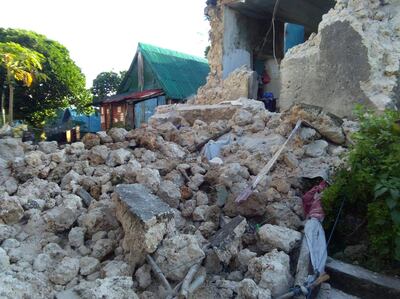 Rubbles lie outside a damaged house in Itbayat town, Batanes islands, northern Philippines after a strong earthquake struck on Saturday July 27, 2019. Two strong earthquakes hours apart struck a group of sparsely populated islands in the Luzon Strait in the northern Philippines early Saturday. (Agnes Salengua Nico via AP)