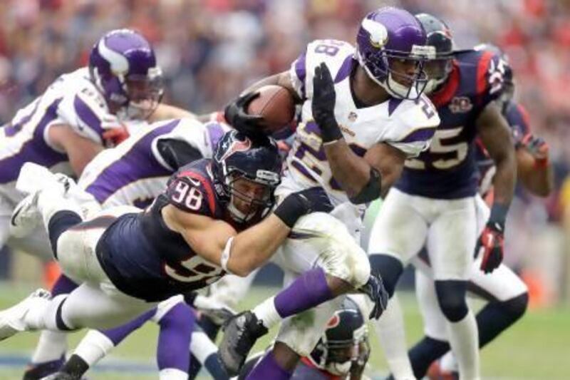 Adrian Peterson, with the ball, has amassed the eighth most rushing yards ever. Patric Schneider / AP Photo