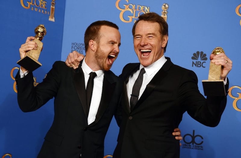 Aaron Paul, left, and Bryan Cranston pose in the press room with the award for best television series - drama for Breaking Bad. AP 