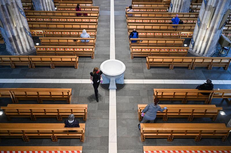 Members of the public pray at St Andrew Cathedral as places of worship reopen for private prayers in Glasgow, Scotland. Places of worship reopened in Scotland today, however only for individual prayer that involves physical distancing. Masses and other large scale services are not permitted yet.  Getty Images